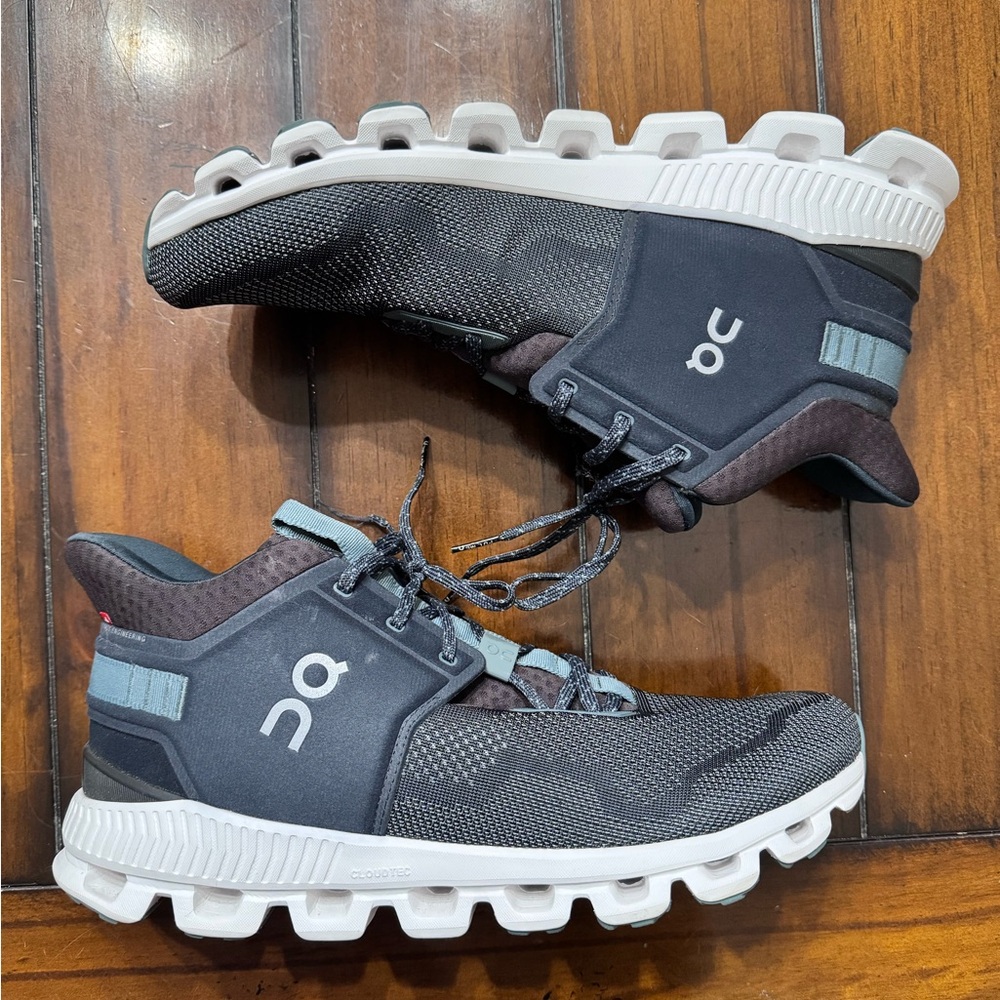 On Running Black and Gray Sneakers with Streamlined Design